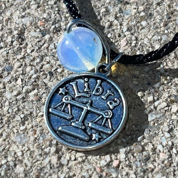 LIBRA IRON ZODIAC AND MOONSTONE PLANET CHARM BLACK SILK CORD NECKLACE - Picture 1 of 6